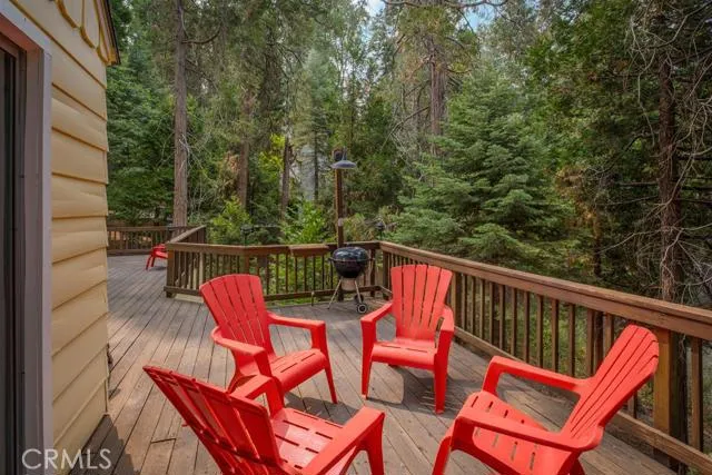 MASSIVE WRAP AROUND DECKING OVERLOOKING THE BACKYARD FOREST.