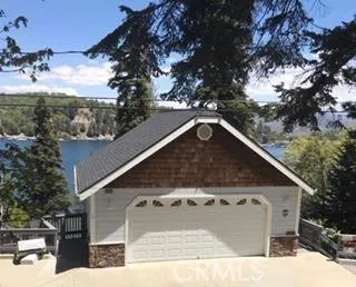 Street Level Photo of Front of Property, which is the oversize 2 car garage. The stairs to both the Main and Guest Houses are to the right of the garage. The Street Level Landing for the 4 person Tram is on the left side of the garage. The garage floor is