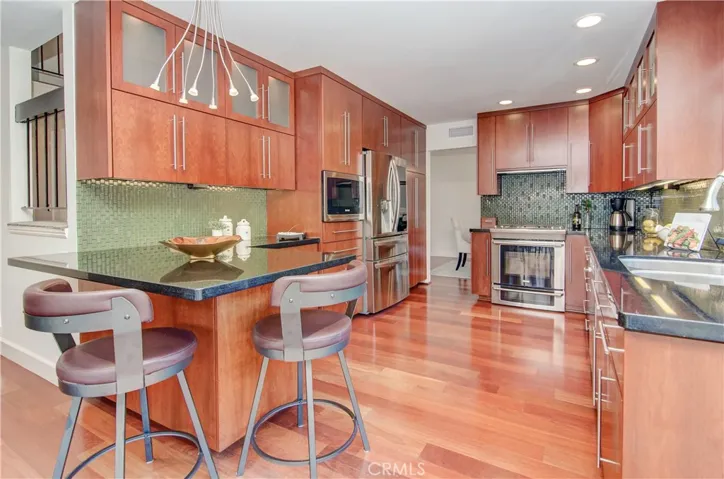 Wow is right...this in an incredible, effecient kitchen that any chef will LOVE...custom, custom, custom features here and high end Electrolux appliances.