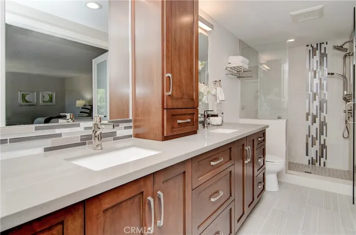 The designer made all of the right decisions here...love the huge, custom shower with multiple shower heads.
