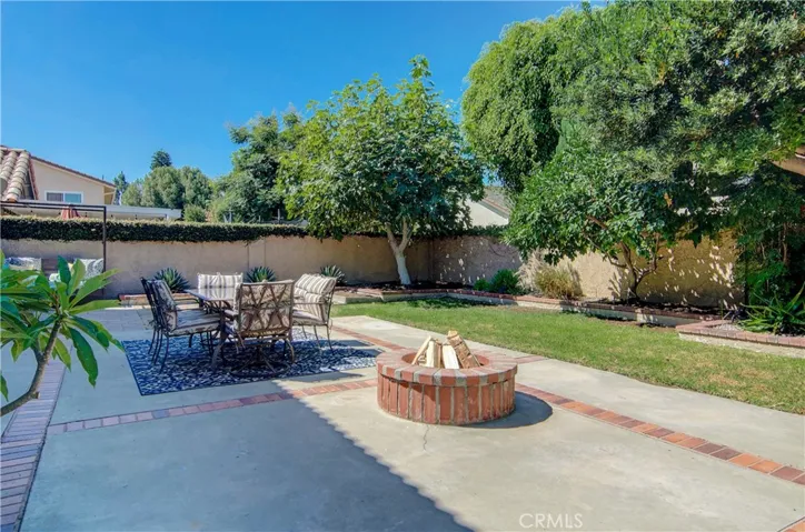 Rear yard has mature trees, raised planters, lawn, patio and most neighboring homes are one story for utmost privacy.