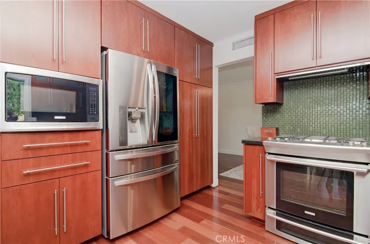 Extra deep cabinents offer extra pantry space and seamlessly integrate the appliances.