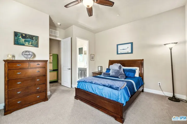 Walk in closet with built in dresser.