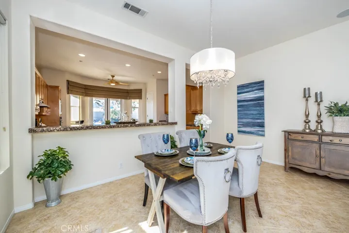 Dining area with granite bar counter to the kitchen.
