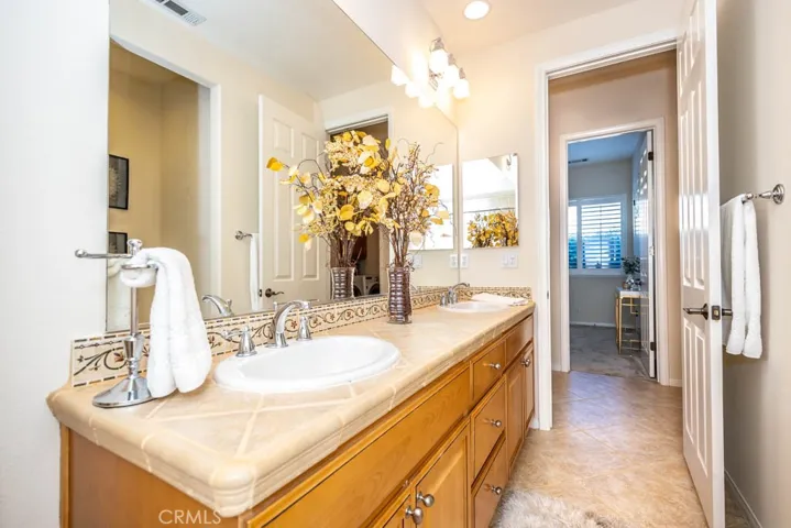 Hall bath with dual sinks.