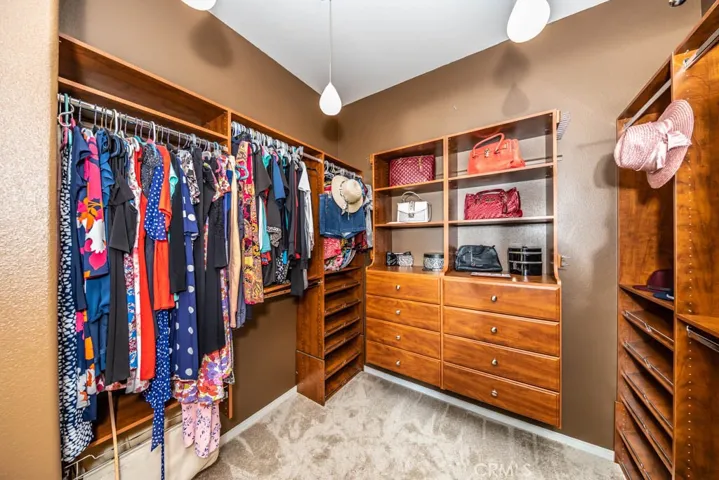 Northwest view of the master closet with built ins.