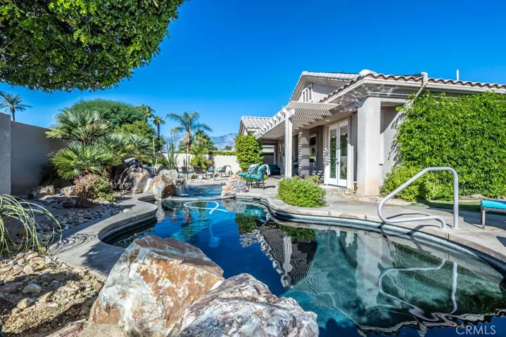 Rock pool with salt water possibilities and cascading waterfall.