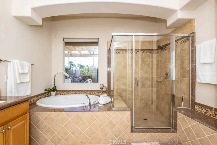 Master tub and walk in shower.