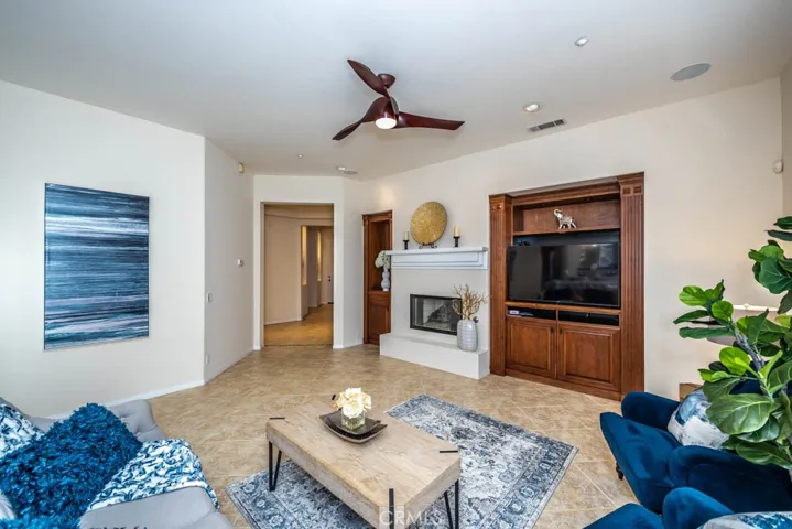 Family room with fireplace and built in cabinets.