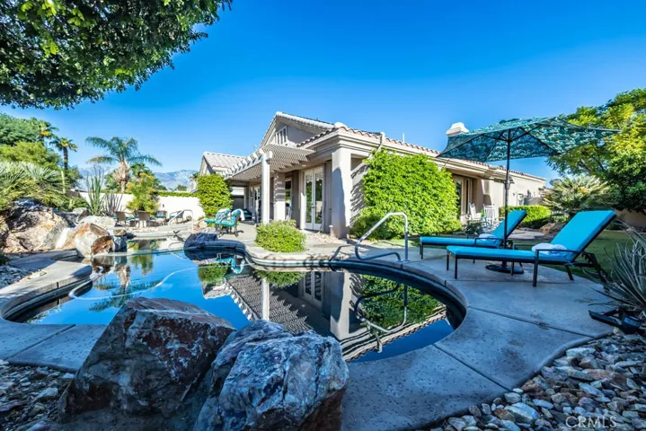 West view of the pool and back yard.