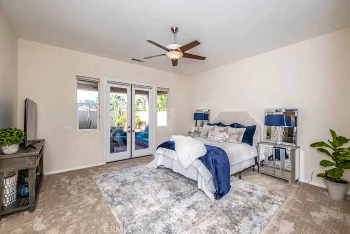 Master bedroom with direct access to the covered patio.
