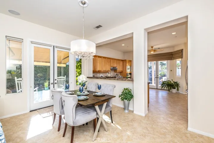 Dining area with double door access to the side patio.