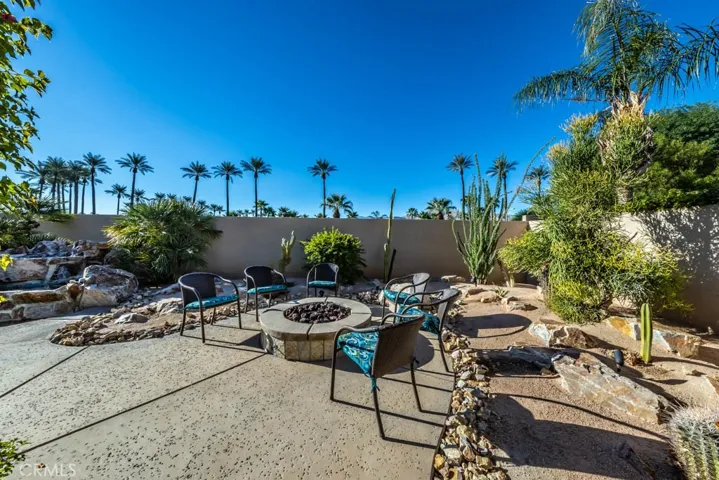 South view of the back yard with fire pit.