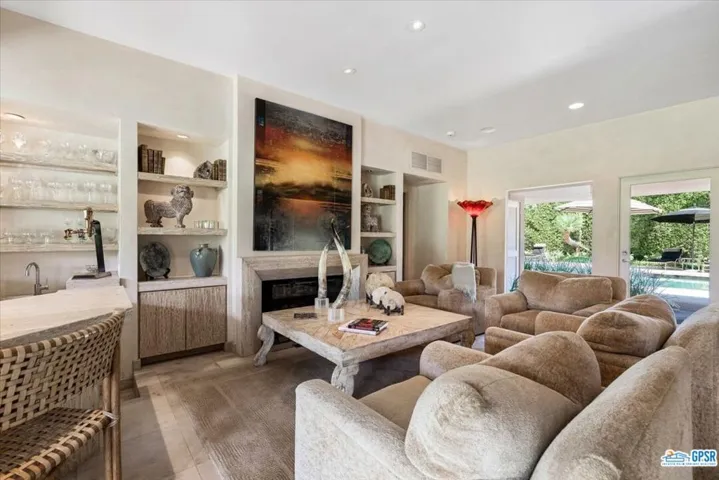 Living room also accesses the front courtyard with pool and spa
