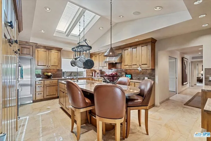 Custom island incorporates tall seating