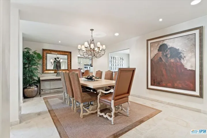 Formal dining room is open to the entry hall