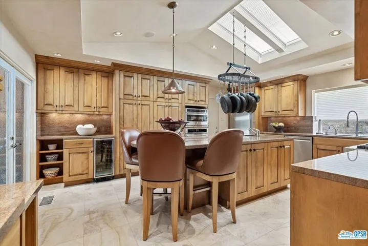 Gorgeous kitchen with slab granite counter tops