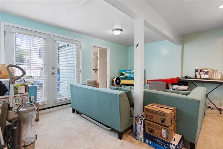Bedroom 3 and bathroom in main house w/ French doors