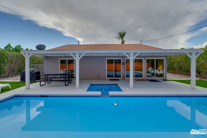 facing south to pool and home