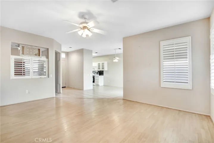 View from living room of entry and kitchen.