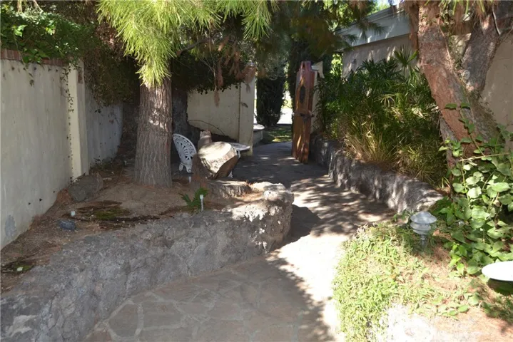 shaded side yard sitting area and walk way