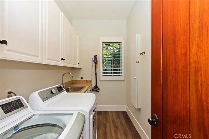 Separate Laundry room with sink and built-in ironing board