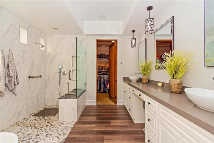 Primary bathroom has separate tub and shower
