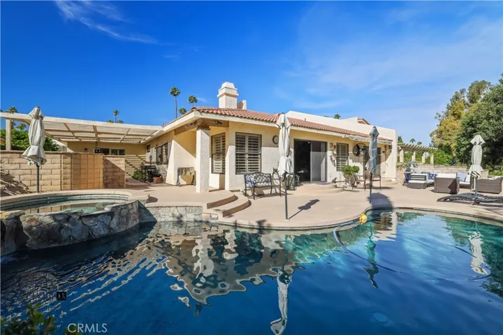 Pool with view towards backyard