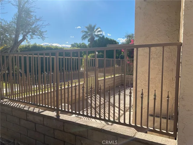 Patio with view of the mature bushes surrounding the pool area