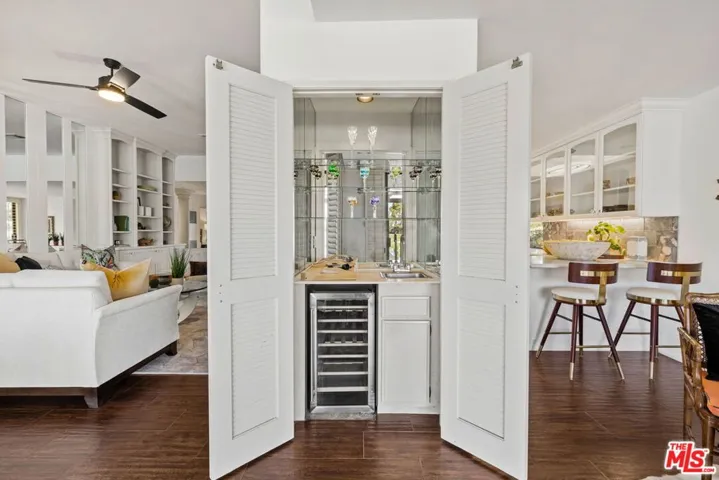 Built-in wet bar between kitchen and living room