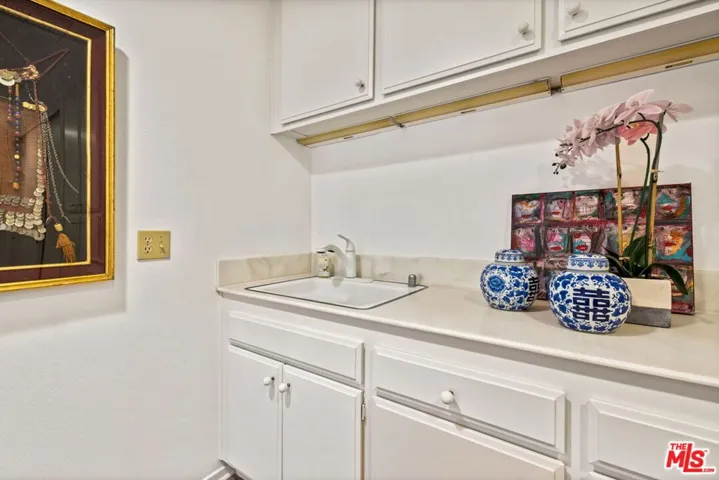 Laundry room sink with abundant cabinetry