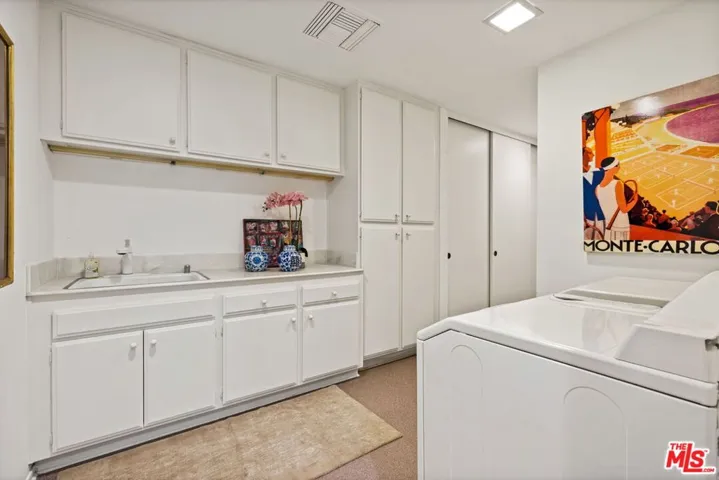 Laundry room with pantry and storage