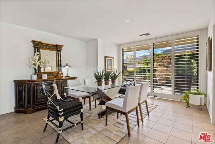 Formal dining room with adjoining side patio