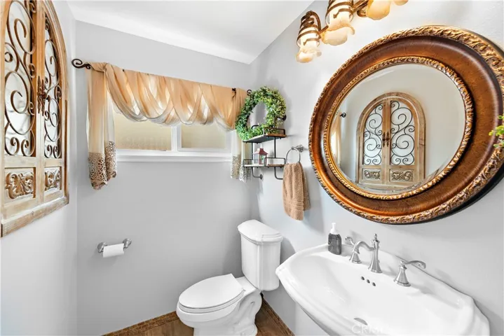 Bathroom between garage entry and kitchen