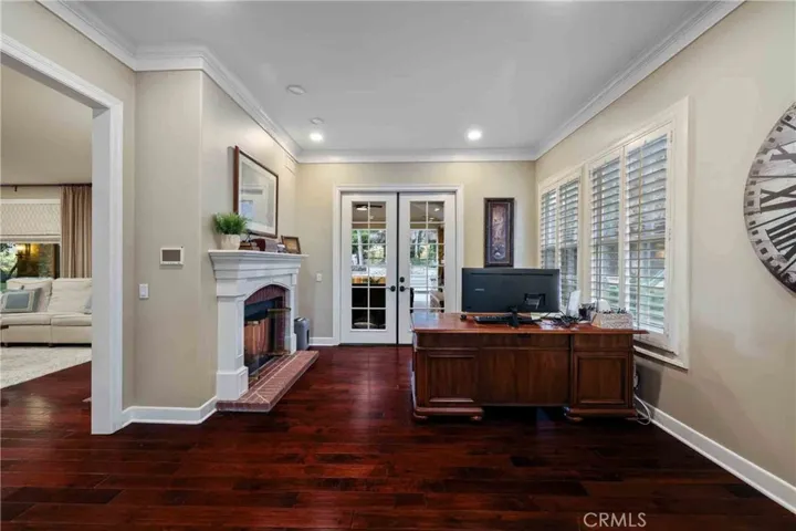 The huge home office downstairs also has a fireplace, with hardwood flooring.