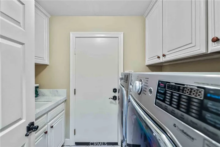 Laundry room with sink