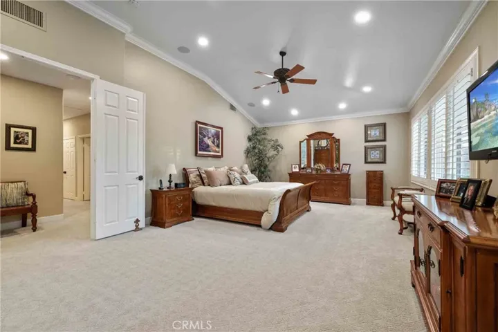 Master bedroom has walk-in closet with organizers.