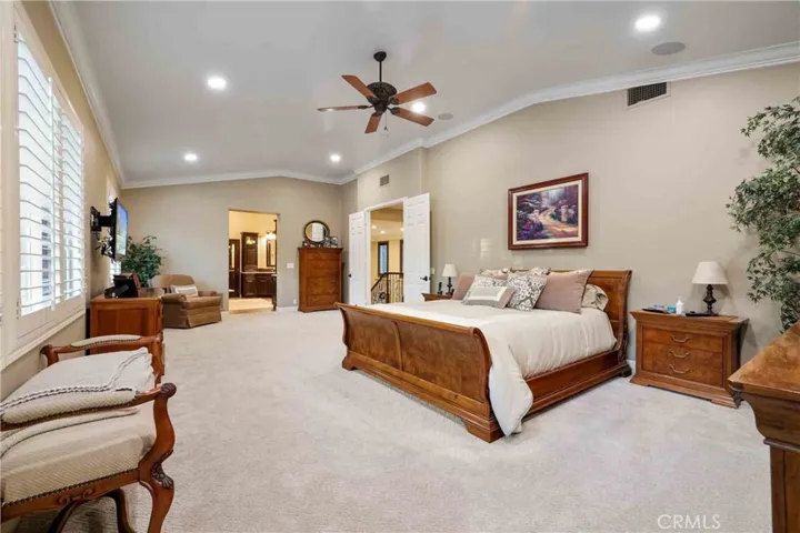 Custom two-tone paint, recessed lights, ceiling fan,  crown moldings, newer carpet.