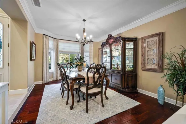 Formal dining room with custom chandelier.
