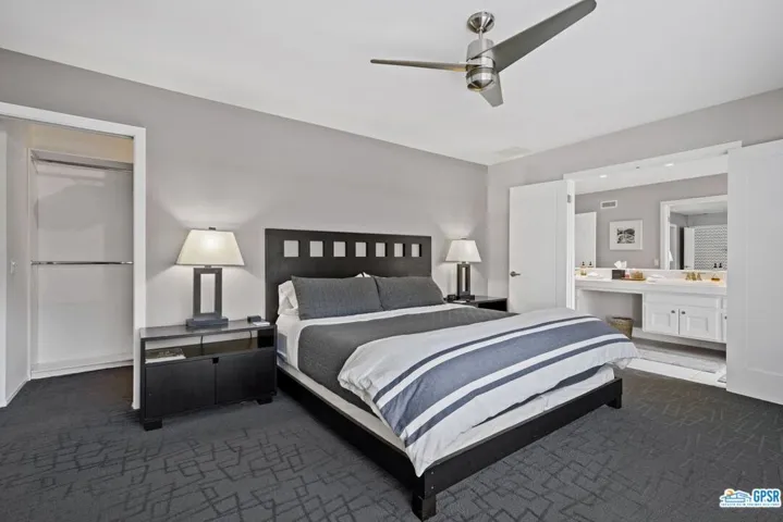 Walk-in closet behind bed wall!