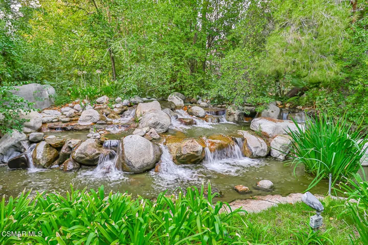 Waterfall flows to a stream