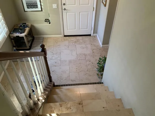Custom travertine tile on stairs
