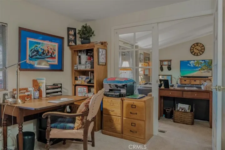 Second bedroom, perfect for a den or office, charming French doors to the living room