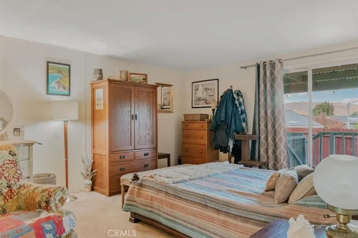 Primary bedroom has sliders to the deck.  Wake up to hill views