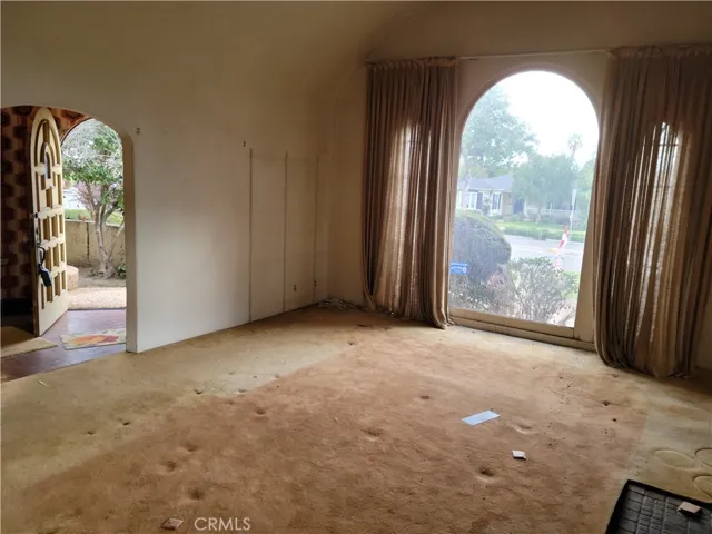 Living Room with high cathedral ceiling and picture windown