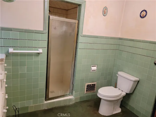 Main bath has separate tub and shower