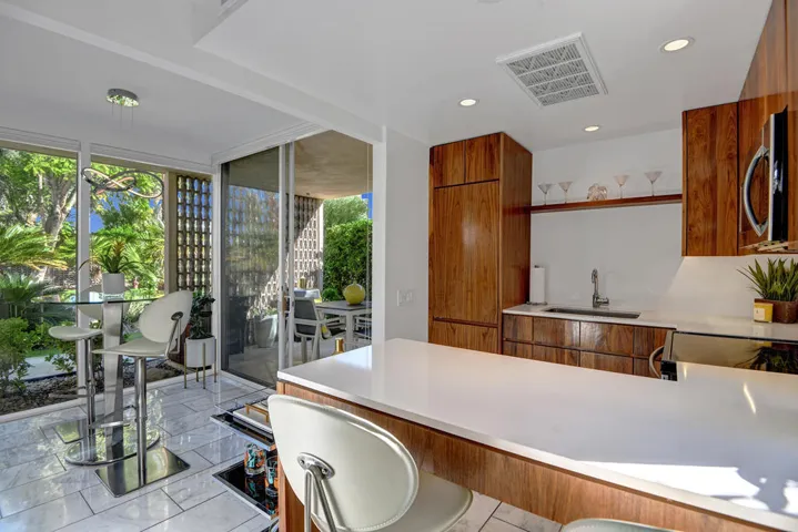 BREAKFAST BAR TO DINING AND PATIO MLS