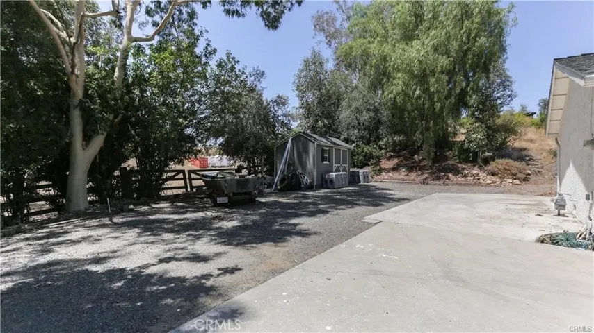 RV area next to garage after current items are removed.