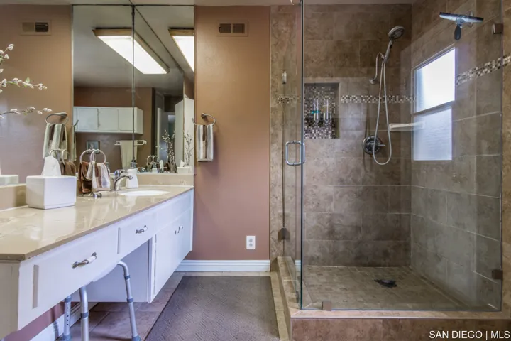 Downstairs Master Bathroom. There is a door leading to Master Bedroom and another door leading to ha