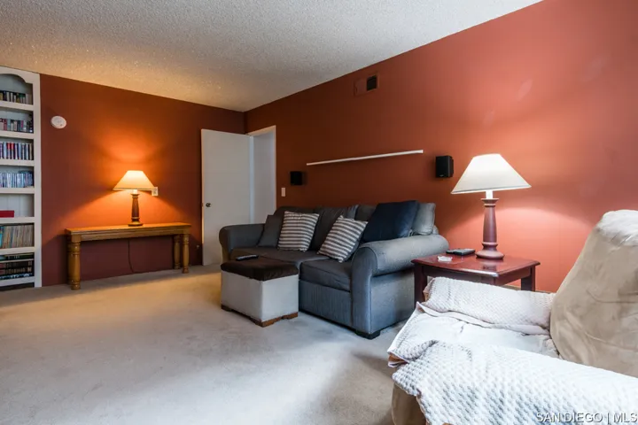 Large den on first level with door to attached garage.